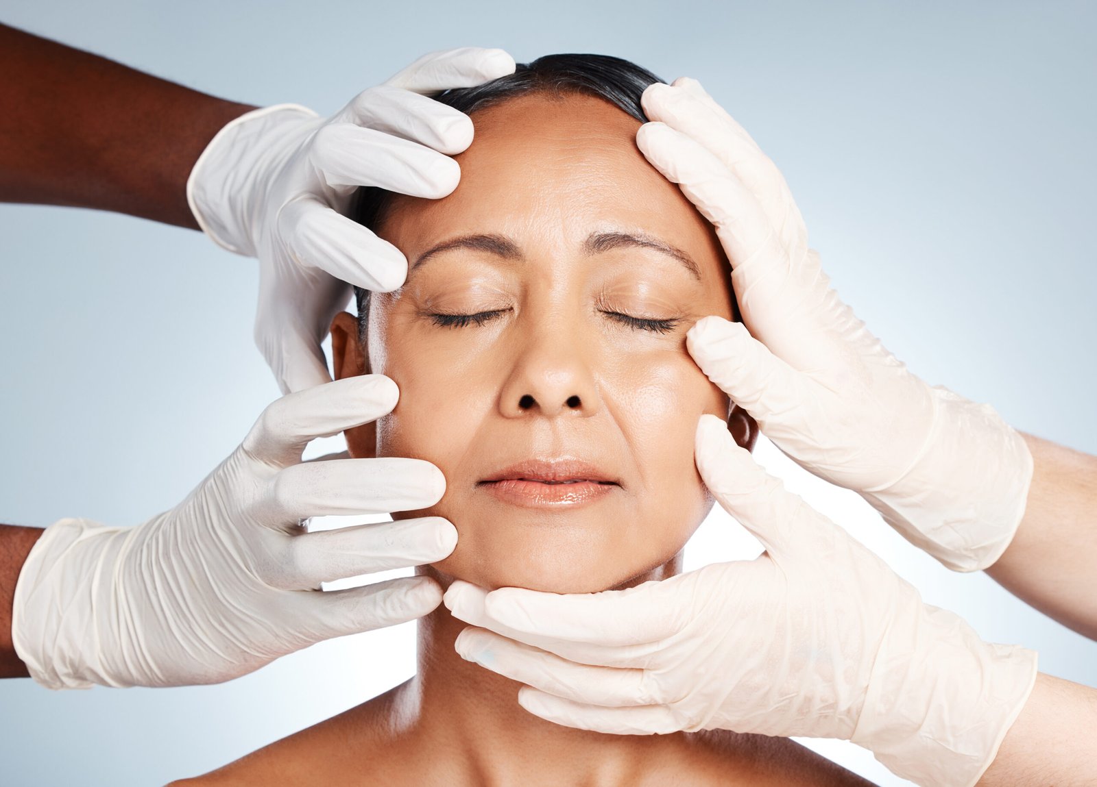 A woman undergoing a facial examination for focus on skin rejuvenating treatments for enhanced appearance.