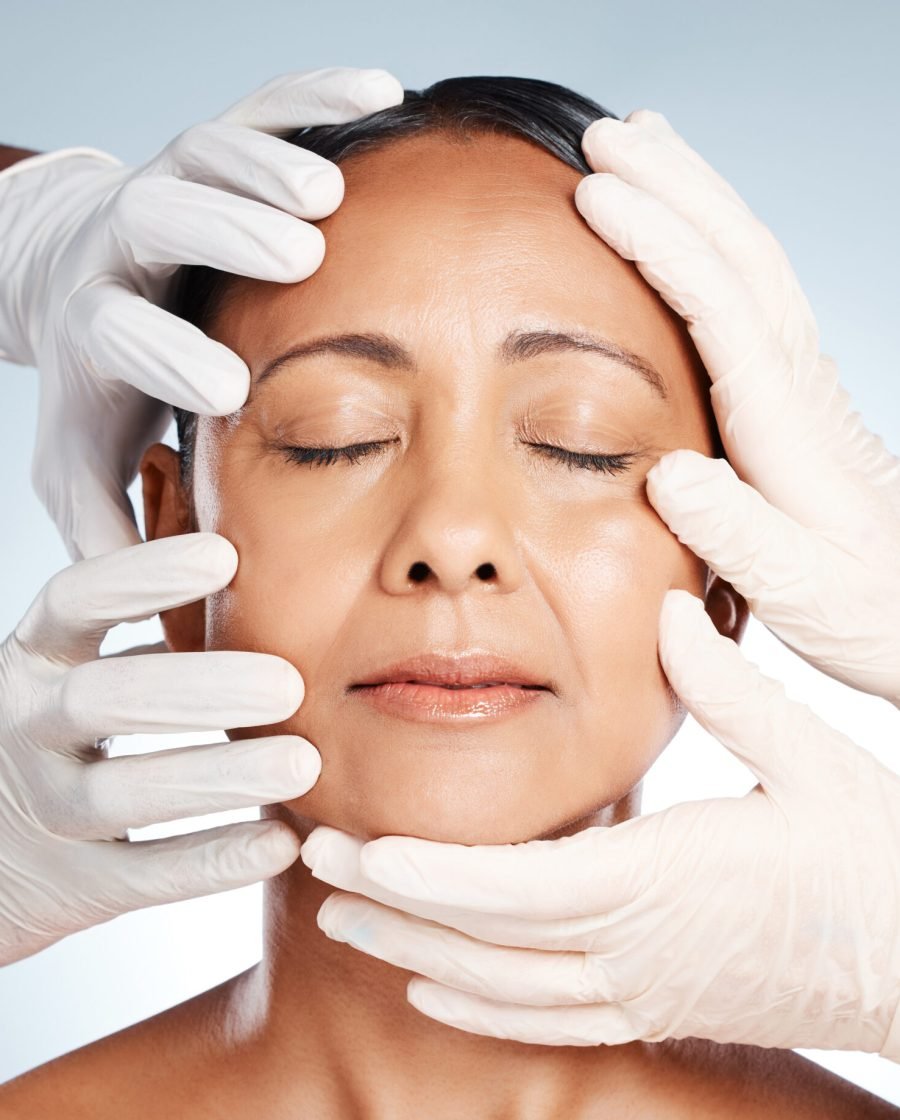 A woman undergoing a facial examination for focus on skin rejuvenating treatments for enhanced appearance.