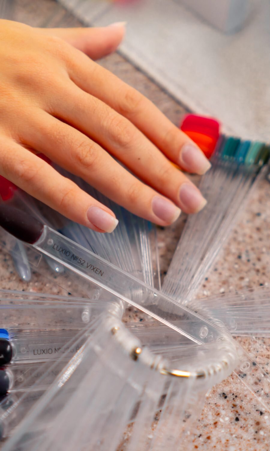 a display of an assortment of nail polish colors, ideal for selecting shades for acrylic nails.